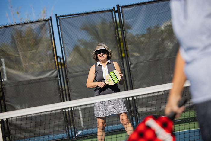A resident enjoying a game of pickle ball.