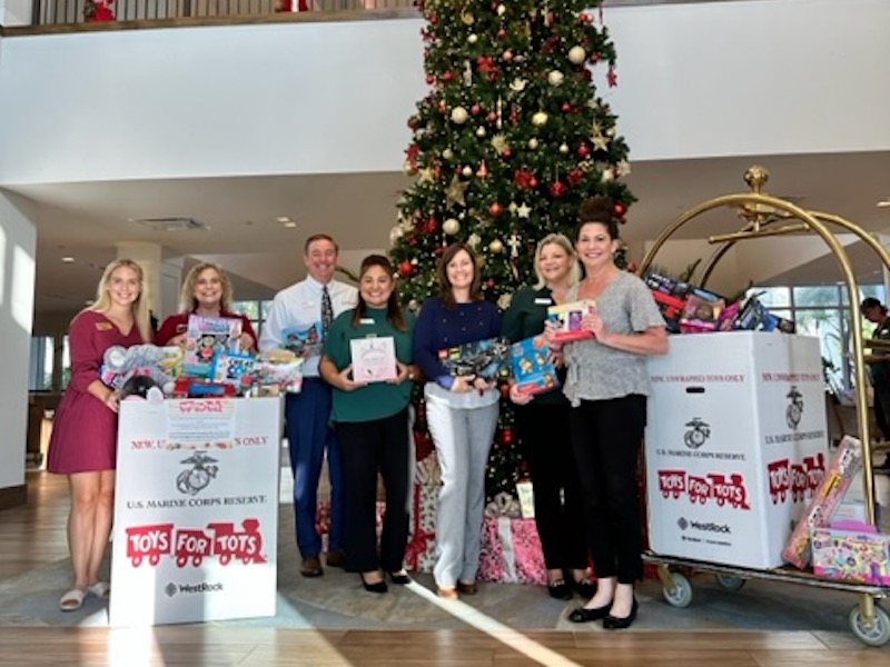 Amavida partners with Tracie and Sam Hurley with Caldwell Banker and Toys for Tots for the Holidays.