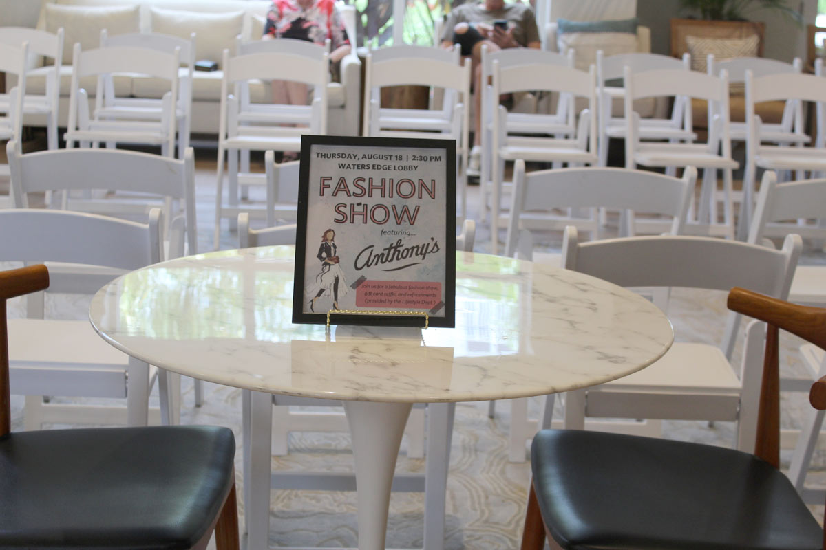 Fashion show featuring Anthonys sign on the table