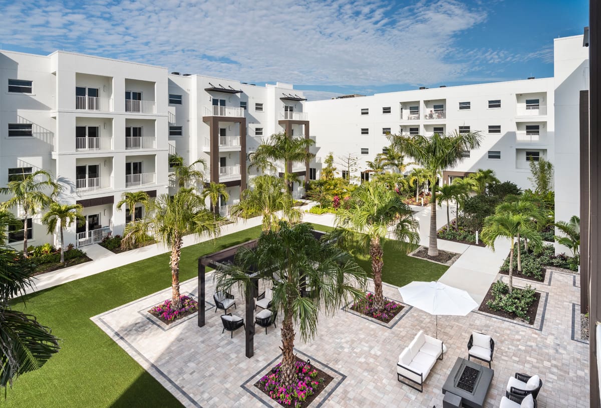 Waters Edge Garden Courtyard Offers A Fire Pit And Seating Areas Throughout.