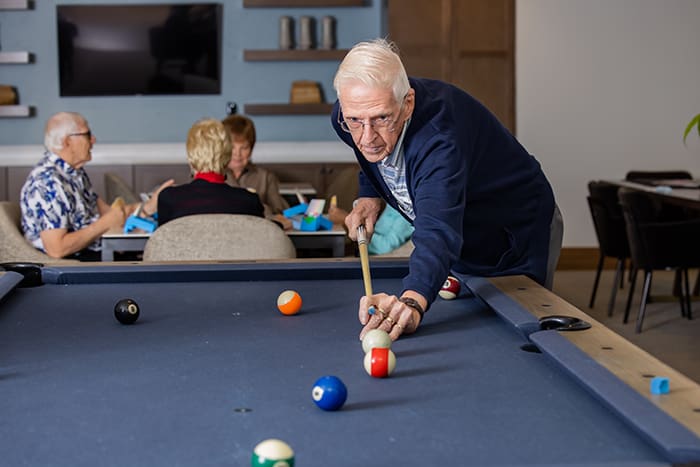 amavida resident playing billiards