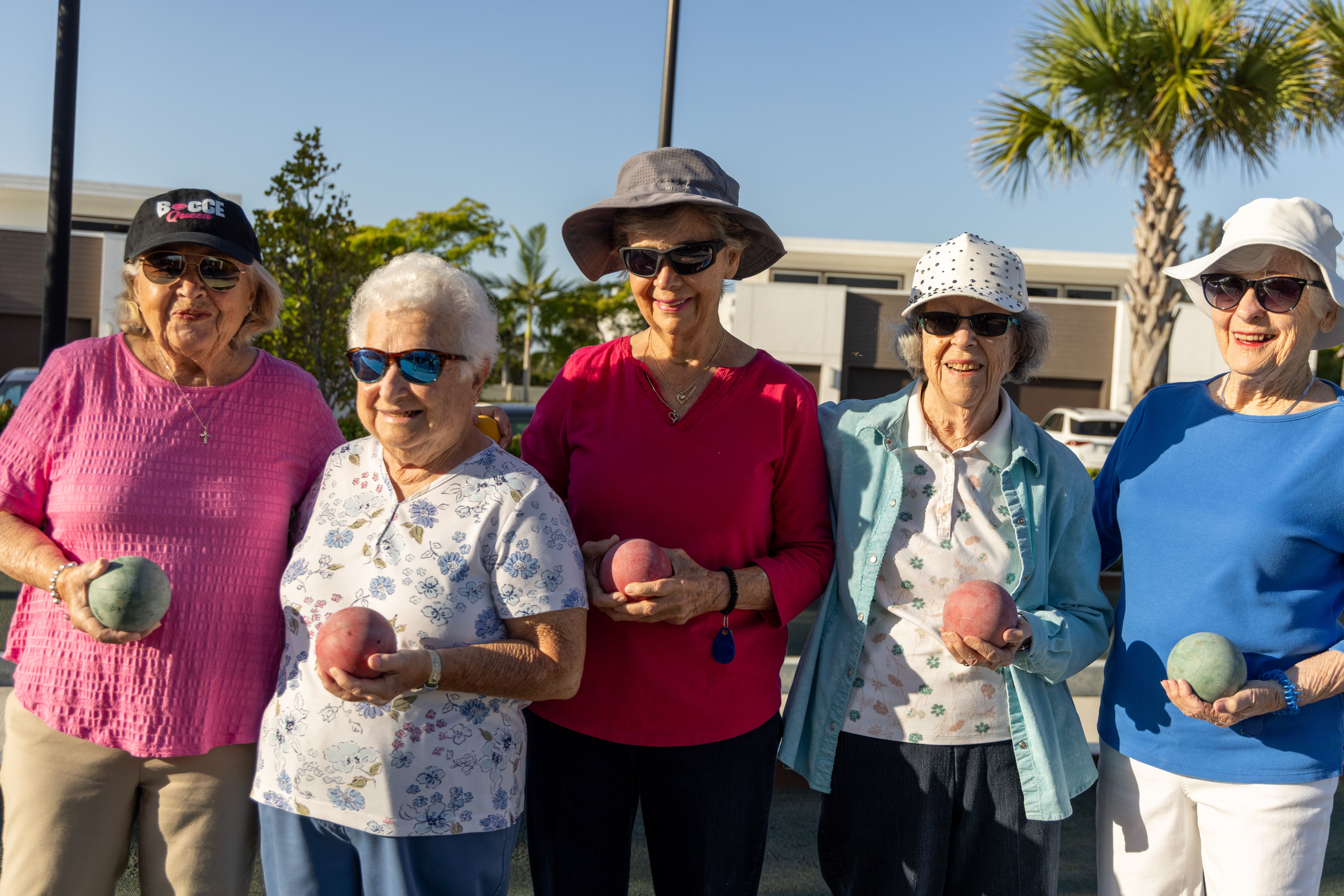 Amavida seniors holding bocce balls